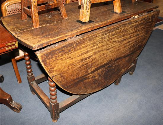 A late 18th century oak gateleg table, W.122cm